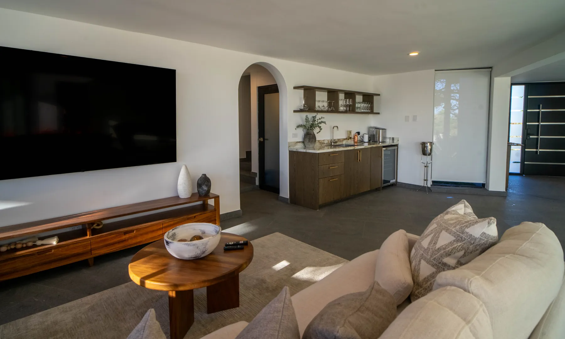Living room seating and kitchenette at the villa