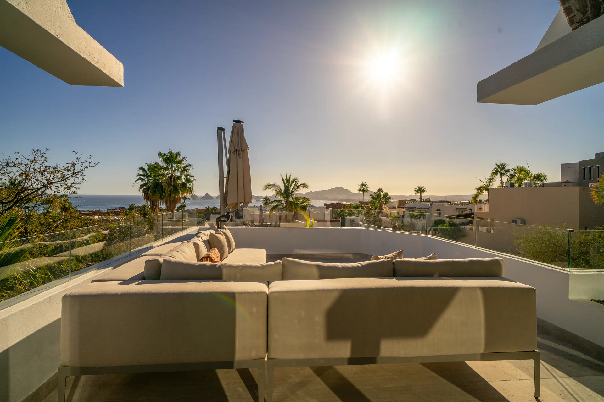 Rooftop lounge overlooking Cabo at golden hour